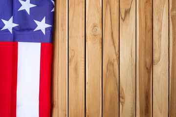 Wall Mural - United States of America flag on wooden table background. USA holiday of Veterans, Memorial, Independence ( Fourth of July) and Labor Day concept