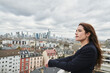 © Annika List/Westend61 - Mid adult female entrepreneur on rooftop in city