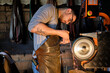 © Antonio Ovejero Diaz/Westend61 - Craftsman sharpening metal on grinder at workshop
