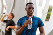 © Ignacio Ferrandiz Roig/Westend61 - Male athlete looking away while holding water bottle