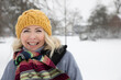 © Frank van Delft/Westend61 - Smiling senior woman wearing knit hat at park