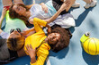 © Ignacio Ferrandiz Roig/Westend61 - Young women leaning on each other at sports court floor