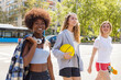 © Ignacio Ferrandiz Roig/Westend61 - Female friends walking on road during sunny day