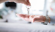 © Jose Carlos Ichiro/Westend61 - Hand handing over house keys