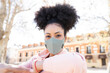 © Jose Carlos Ichiro/Westend61 - Woman wearing protective face mask during pandemic