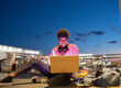 © Jose Carlos Ichiro/Westend61 - Woman using laptop during night