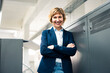 © Joseffson/Westend61 - Cheerful businesswoman standing with arms crossed in workshop