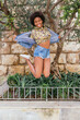 © Julio Rodriguez/Westend61 - Carefree woman in denim jacket jumping