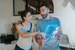 © Infinite Lux/Westend61 - Physiotherapist and female patient discussing anatomical model on transparent screen