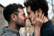 © Malte Jager/Westend61 - Gay couple standing face to face while romancing outdoors