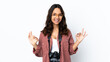 © luismolinero - Young photographer woman over isolated white background showing ok sign with two hands