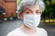 © Katharina und Ekaterina/Westend61 - Mature woman with protective face mask during pandemic