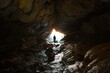 © Valentin Weinhaupl/Westend61 - New Zealand, South Island, Fiordland National Park, Man at entrance of cave