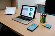 © Xavier Lorenzo/Westend61 - Laptop with smart phone and digital tablet on wooden desk at office