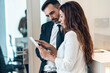 © JOSEP SURIA/Westend61 - Businesswoman discussing with male professional in office