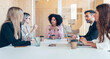 © JOSEP SURIA/Westend61 - Multi-ethnic professionals planning business strategy in office