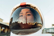 © Eugenio Marongiu/Westend61 - Female astronaut wearing helmet during sunset