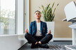 © Eugenio Marongiu/Westend61 - Young female entrepreneur meditating while sitting in office