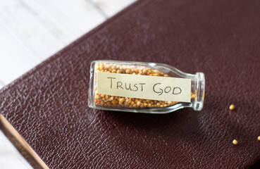Wall Mural - Mustard seed faith. Trust in God Jesus Christ. Bottle with handwritten Bible text and mustard seeds. Strong faith and hope in God's Word and His promises. A close-up.