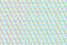 Three Dimensional Pattern Of Rows Of Bubbles Against Green Background