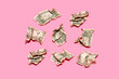 © Gemma Ferrando/Westend61 - Studio shot of eight crumpled one dollar bills