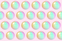 Three Dimensional Pattern Of Rows Of Bubbles Against Pink Background