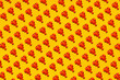 © Gemma Ferrando/Westend61 - Pattern of rows of plastic lobsters flat laid against yellow background