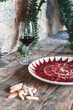 © Josu Acosta/Westend61 - Slice of red meat in plate on table by drink