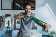© Mareen Fischinger/Westend61 - Smiling male physical therapist stretching resistance band in practice