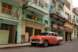 © Robert Niedring/Westend61 - Orange and white vintage car in old town