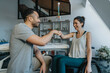 © Mareen Fischinger/Westend61 - Happy female patient and physiotherapist giving fist bump in medical practice
