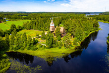 Aerial View Of Wooden Lakeshore Church In Summer