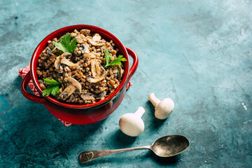 Wall Mural - Buckwheat with mushrooms. Grits platter with fried mushrooms