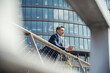 © Uwe Umstatter/Westend61 - Thoughtful businessman leaning on railing