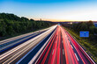 © Werner Dieterich/Westend61 - Light trails at a motorway at dusk, Leonberg, Germany