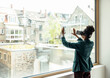 © Uwe Umstatter/Westend61 - Female professional touching glass window while using virtual reality headset at office