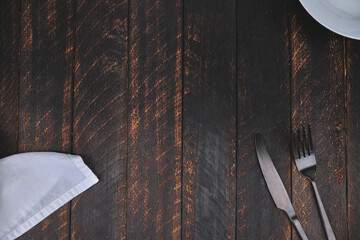 Decorated cutlery, fork and knife on a blue napkin, mockup. Selective focus