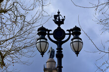 Bottom View Of A Navy Themed Lantern With Duke Of York Column In The Background Against Overcast Sky, Waterloo Plaza, London, UK