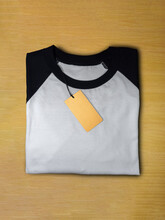 Tag Price On Folded Black White Raglan T-shirt