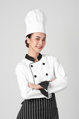 Beautiful young asian woman chef on white background,