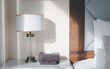 A bedside lamp that shines in the morning sunlight into the bedroom.