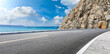 Asphalt highway and mountain with blue sea natural landscape.