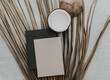 Creative summer minimal mock-up. Dried palm leaves and coconut  on neutral background. Still life minimal concept. Flat lay, top view, copy space, square