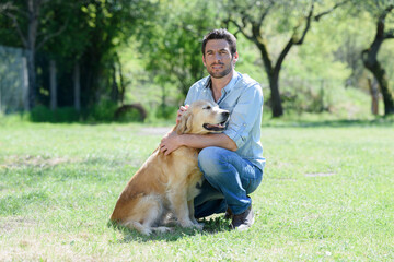 man and dog in park