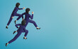 © srenhouse - A 3D rendering business women running on isolated blue color background.