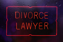 Red Neon Divorce Lawyer Sign In Rainy Window