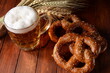 Bavarian freshly baked  homemade soft pretzel with beer. Rustic style. Oktoberfest