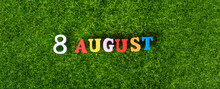 August 8. Image Of Wooden Colored Letters And Numbers On August 8 Against The Background Of A Green Lawn, World Cat Day. A Summer Day.