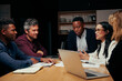 © StratfordProductions - Group of diverse business executives in meeting around a table discussing new start up project