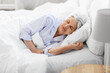 © Syda Productions - old age and people concept - senior woman sleeping in bed at home bedroom